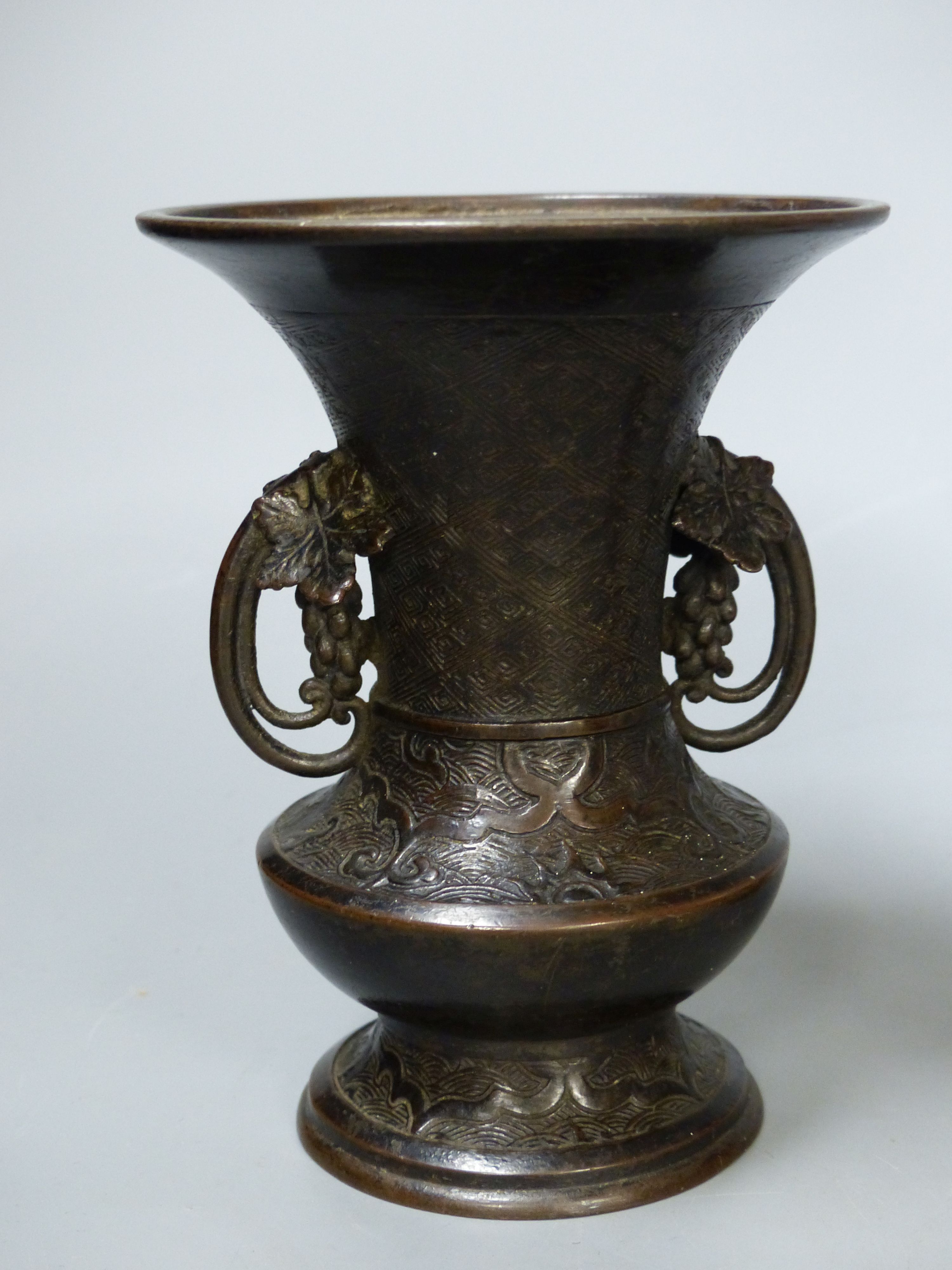 A Chinese underglaze copper red vase, an archaistic bronze vase and a hardstone brushwasher, tallest 25cm